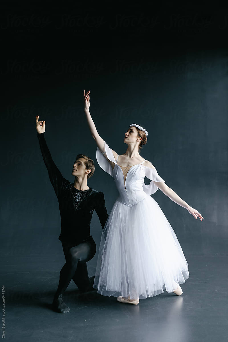 Ballet dance couple performing same choreography movement