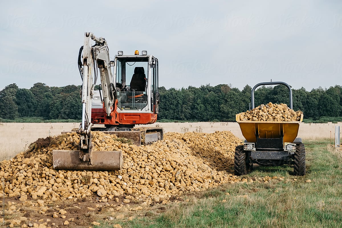 Digger and dumper on a construction site. Norfolk, UK.