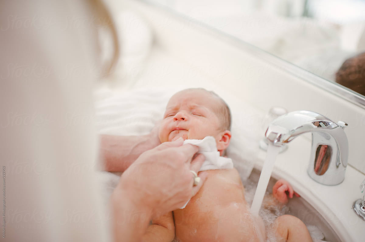 giving newborn first bath