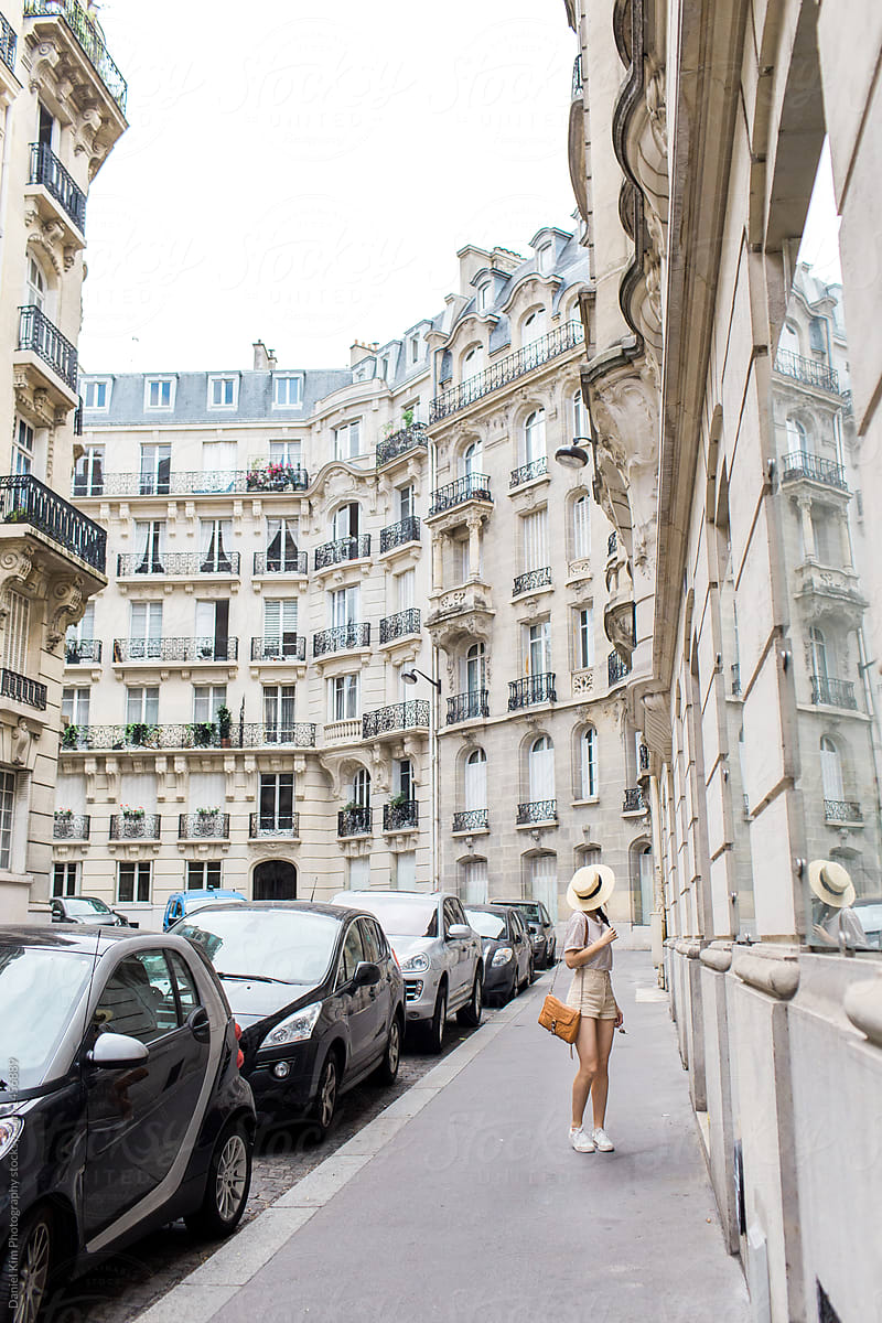 Woman walking in Paris city streets