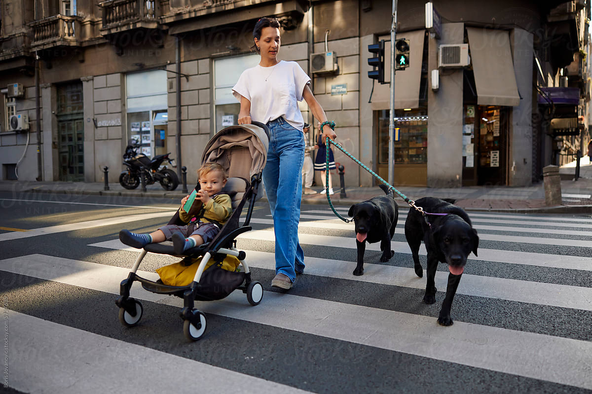 Portrait of a family walking across the street