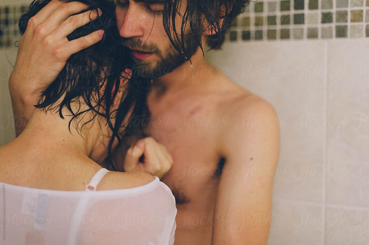 Wet Couple Standing in a Shower