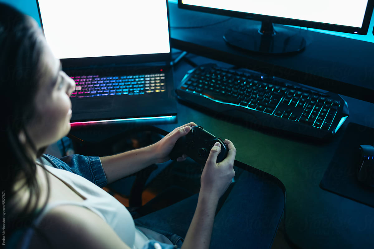 Close-up of a gamer playing video games on the computer