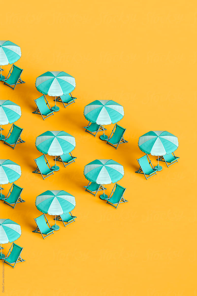 many blue beach umbrellas and chairs