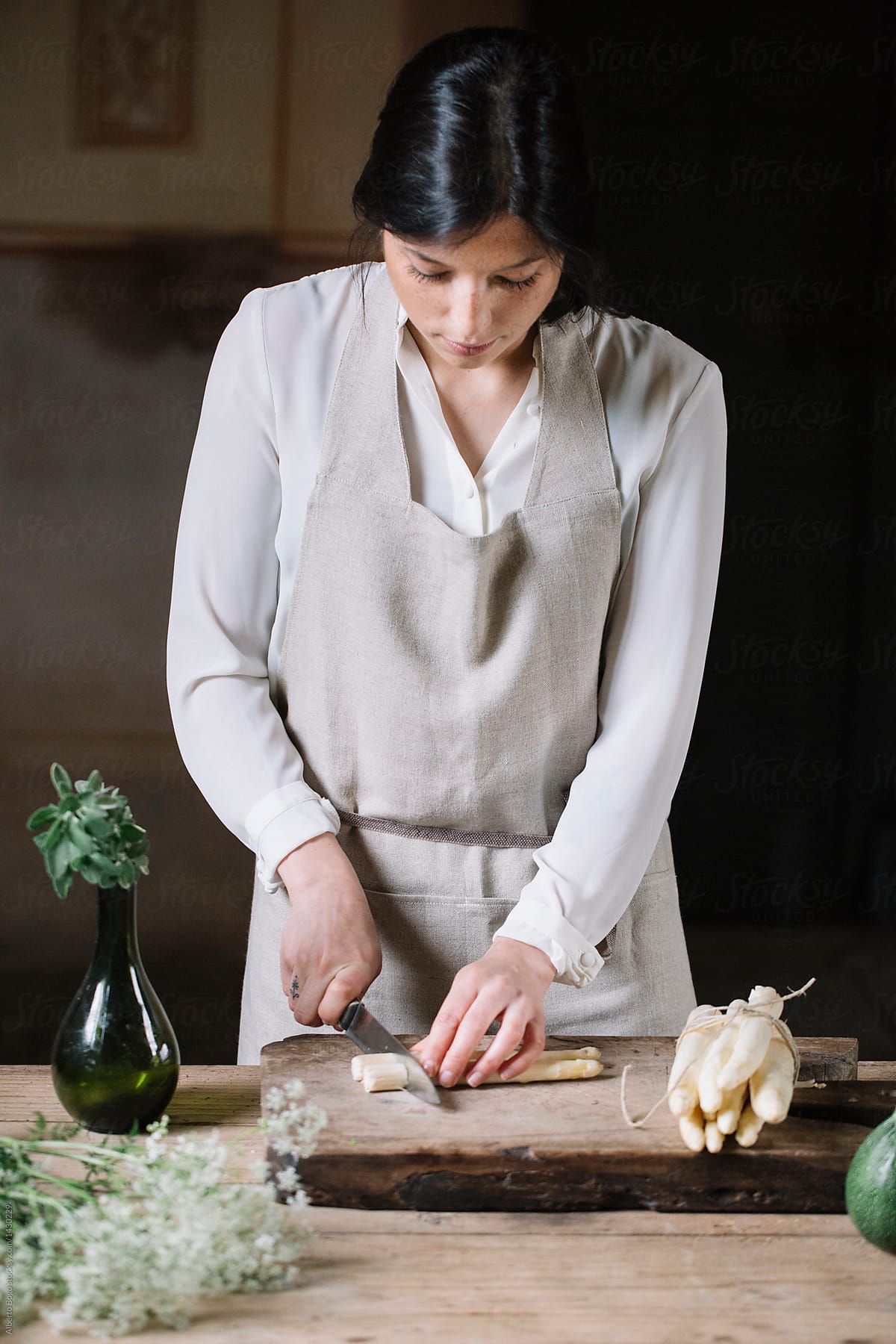 Woman cutting vegetable