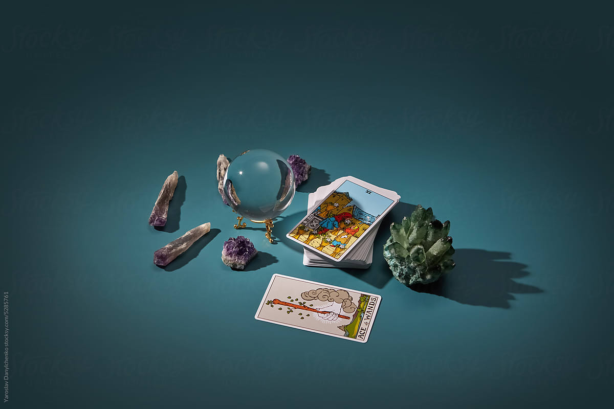 Tarot cards, crystal sphere and magic quartz.