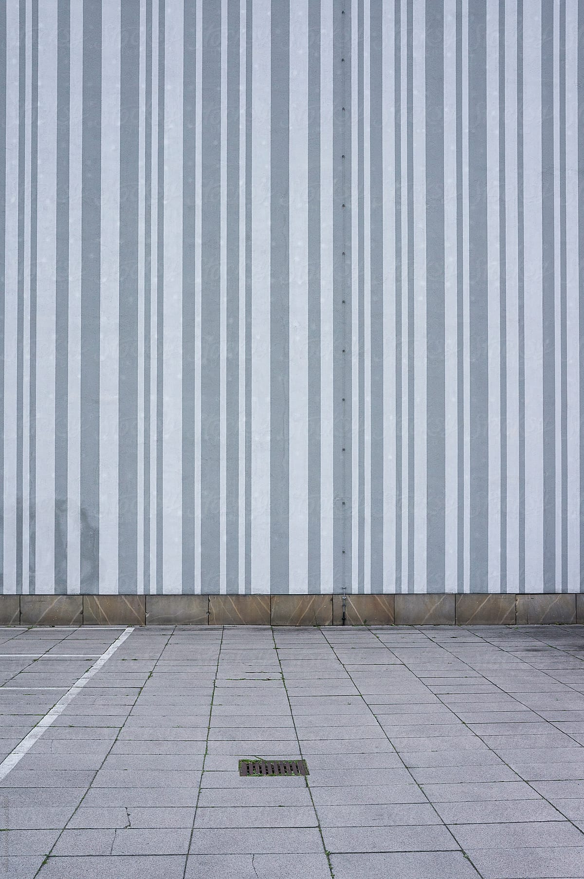 Striped wall and parking lot