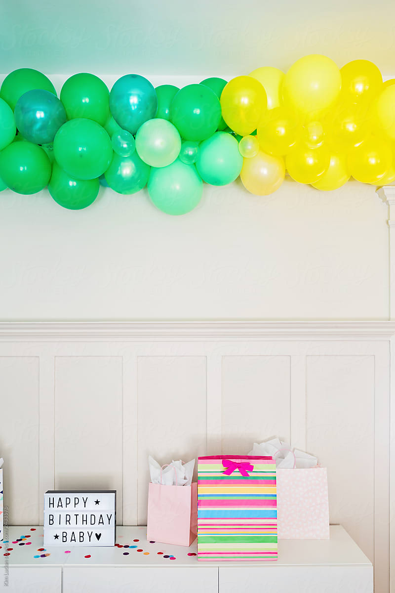 Balloon Arch over Gifts and Happy Birthday Sign