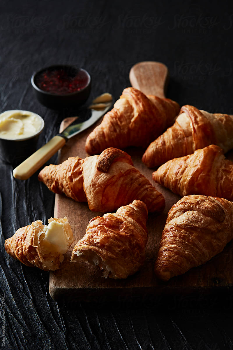 Several Croissants on a Cutting Board