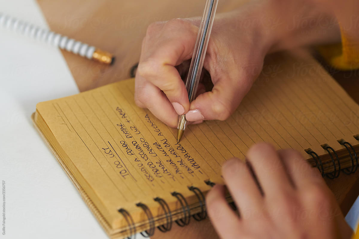 Woman writing to-do list