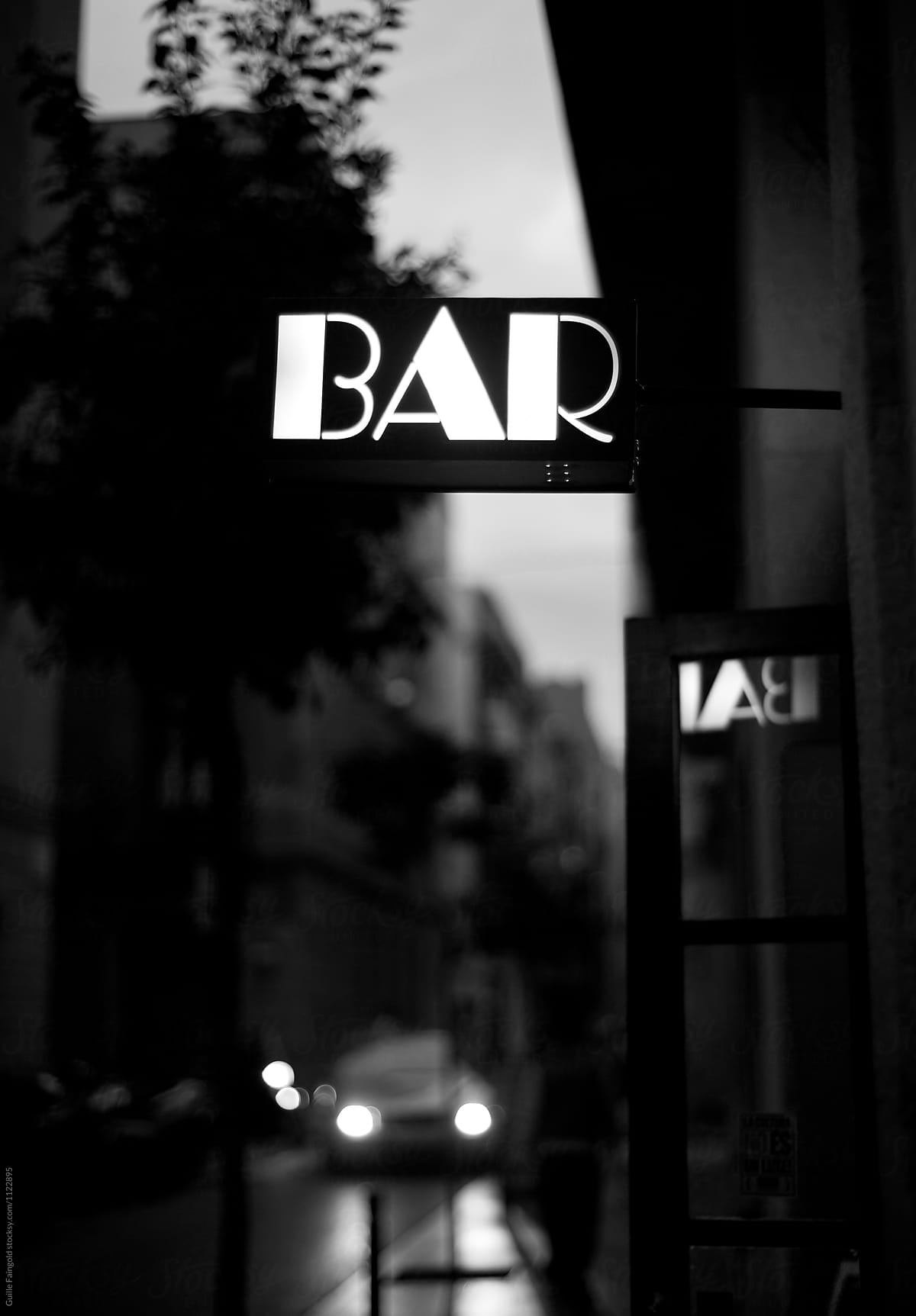 Bar signboard illuminated in the street