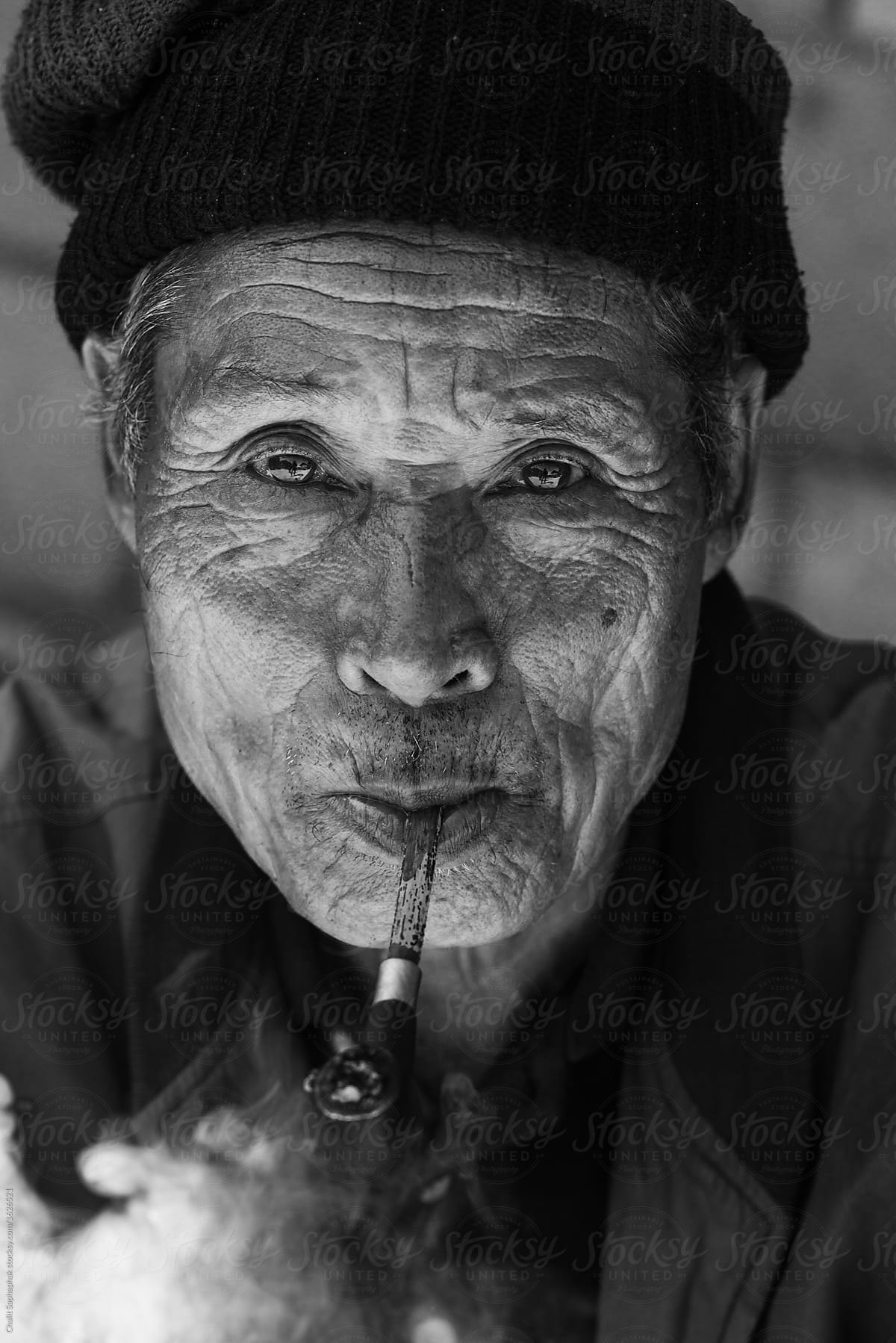 Old man smoking pipe