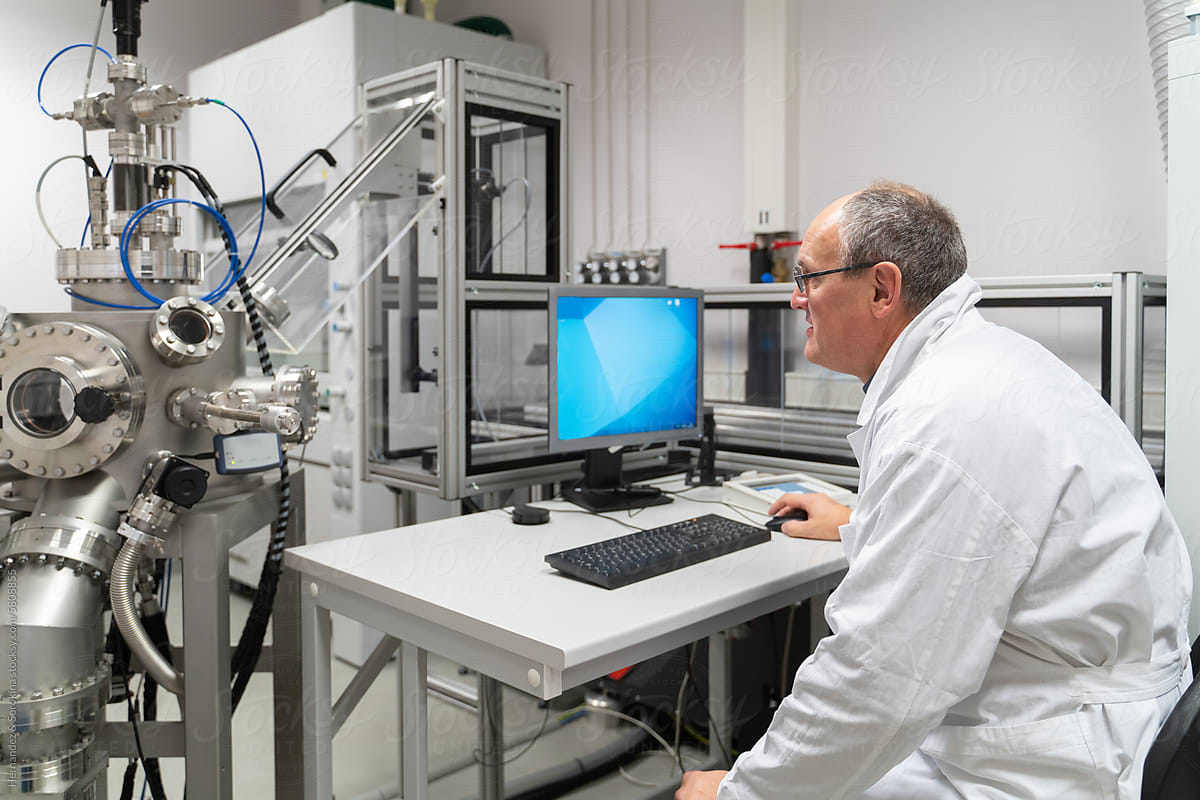 Researcher Working With Equipment In Laboratory