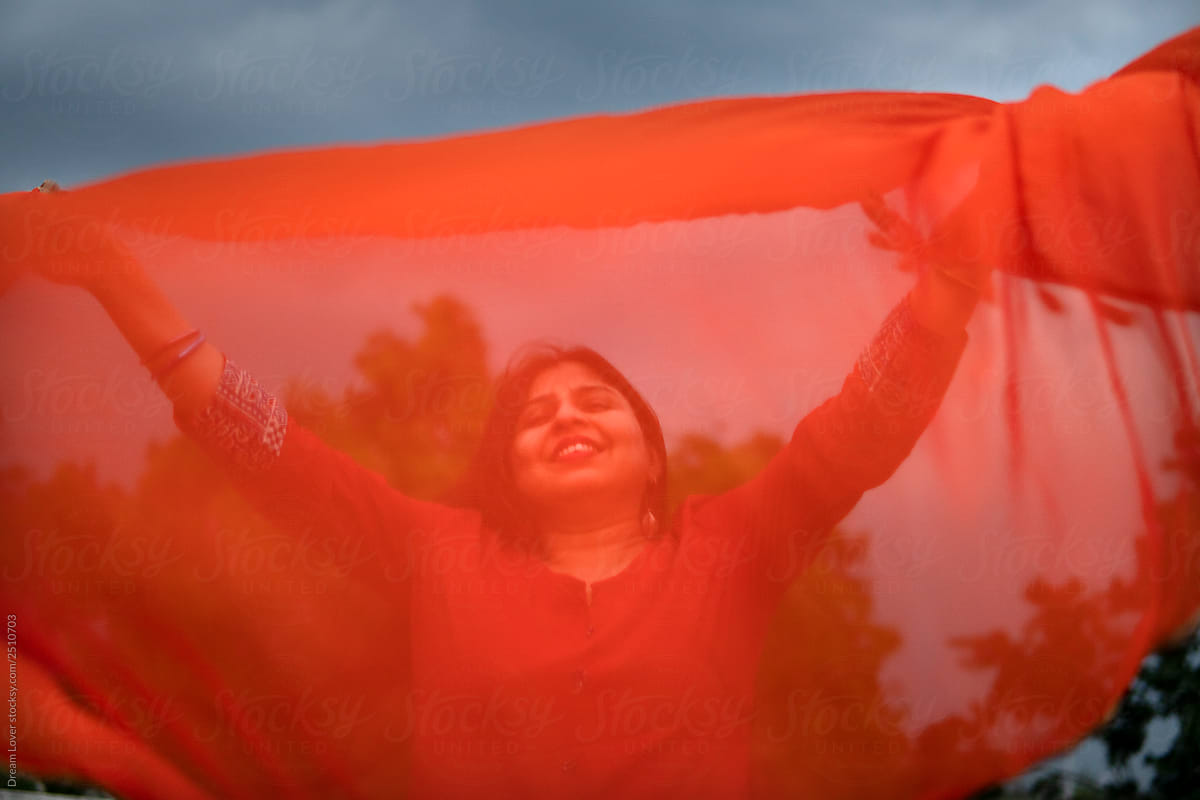 Indian woman enjoying monsoon breeze at outdoors