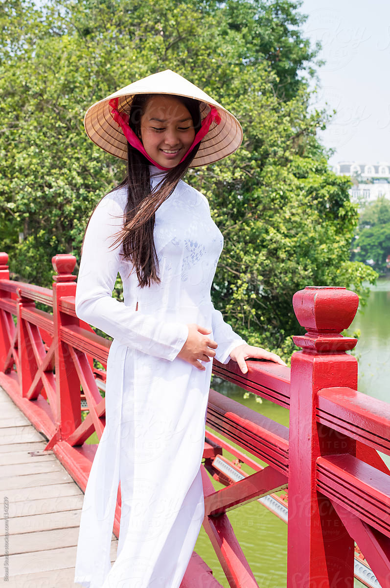 Vietnamese woman resting on bridge