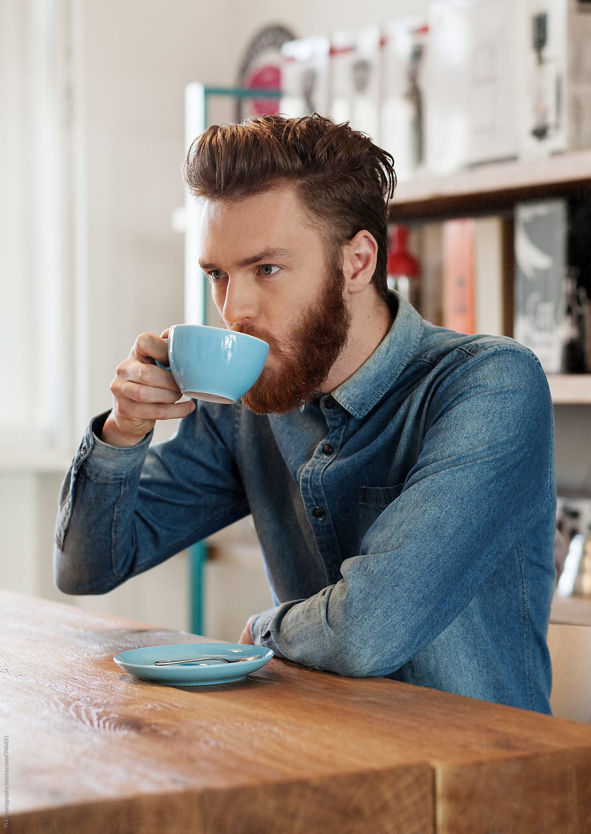 Young man with beard drinking coffee