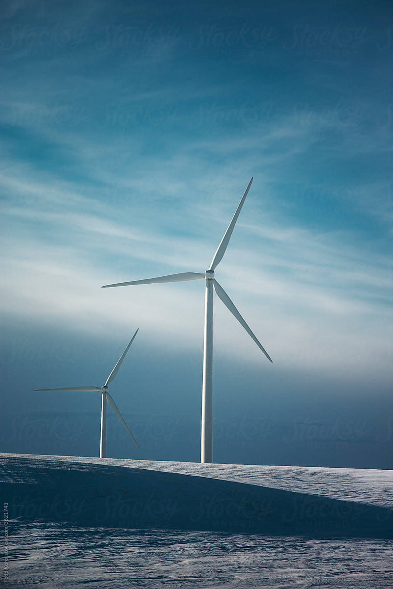Windmills on the prairies during winter.