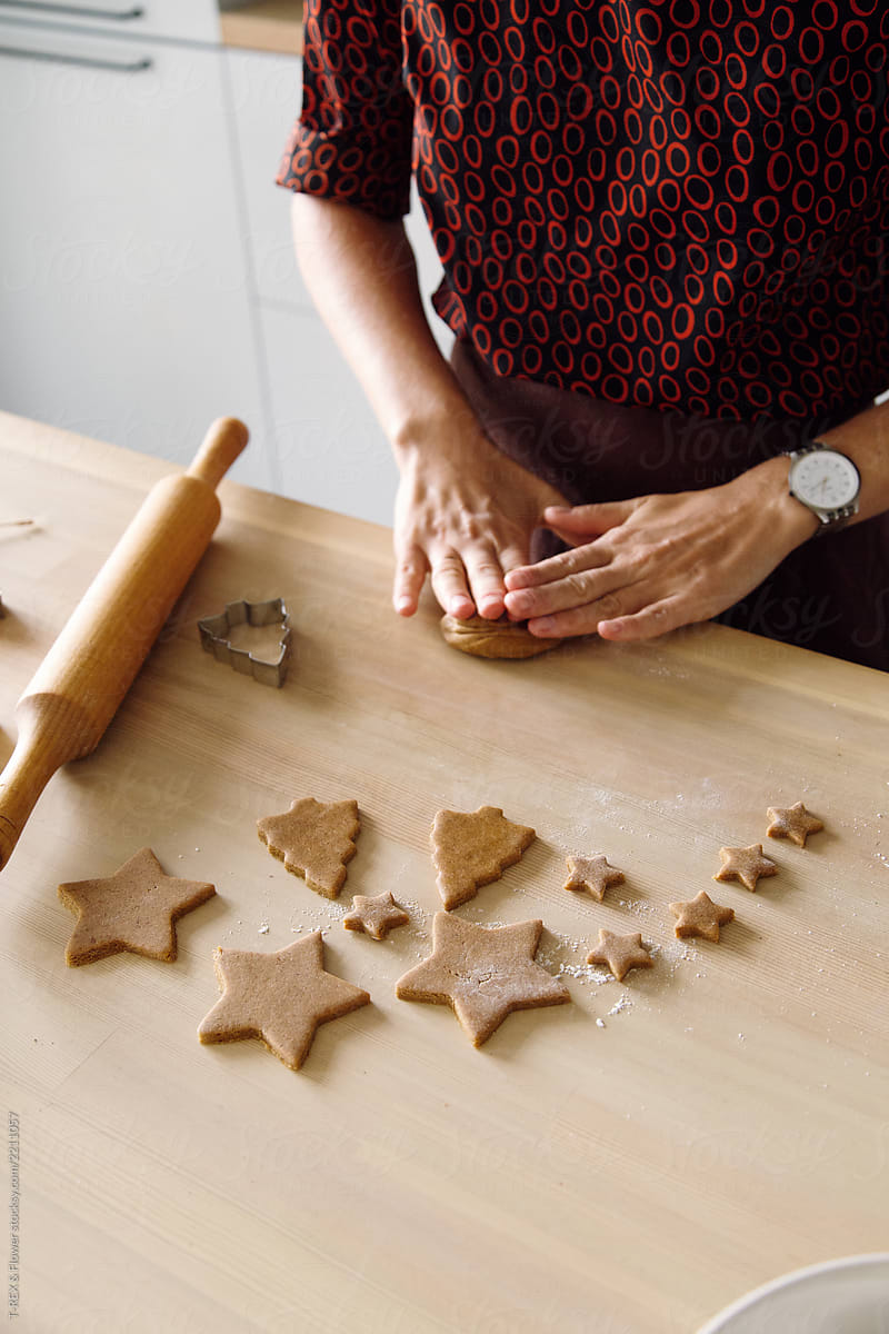 Crop woman kneading gingerbread dough