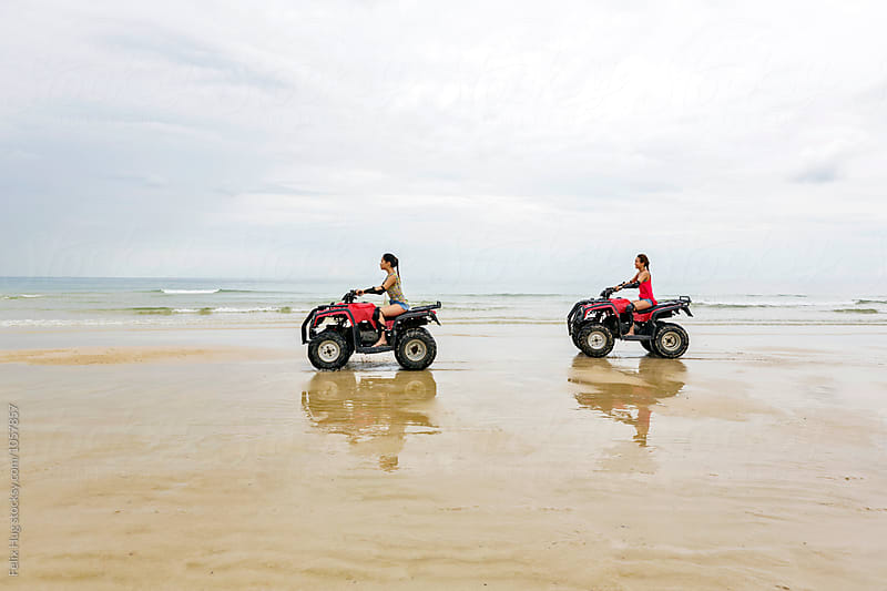 Two girls driving an ATV