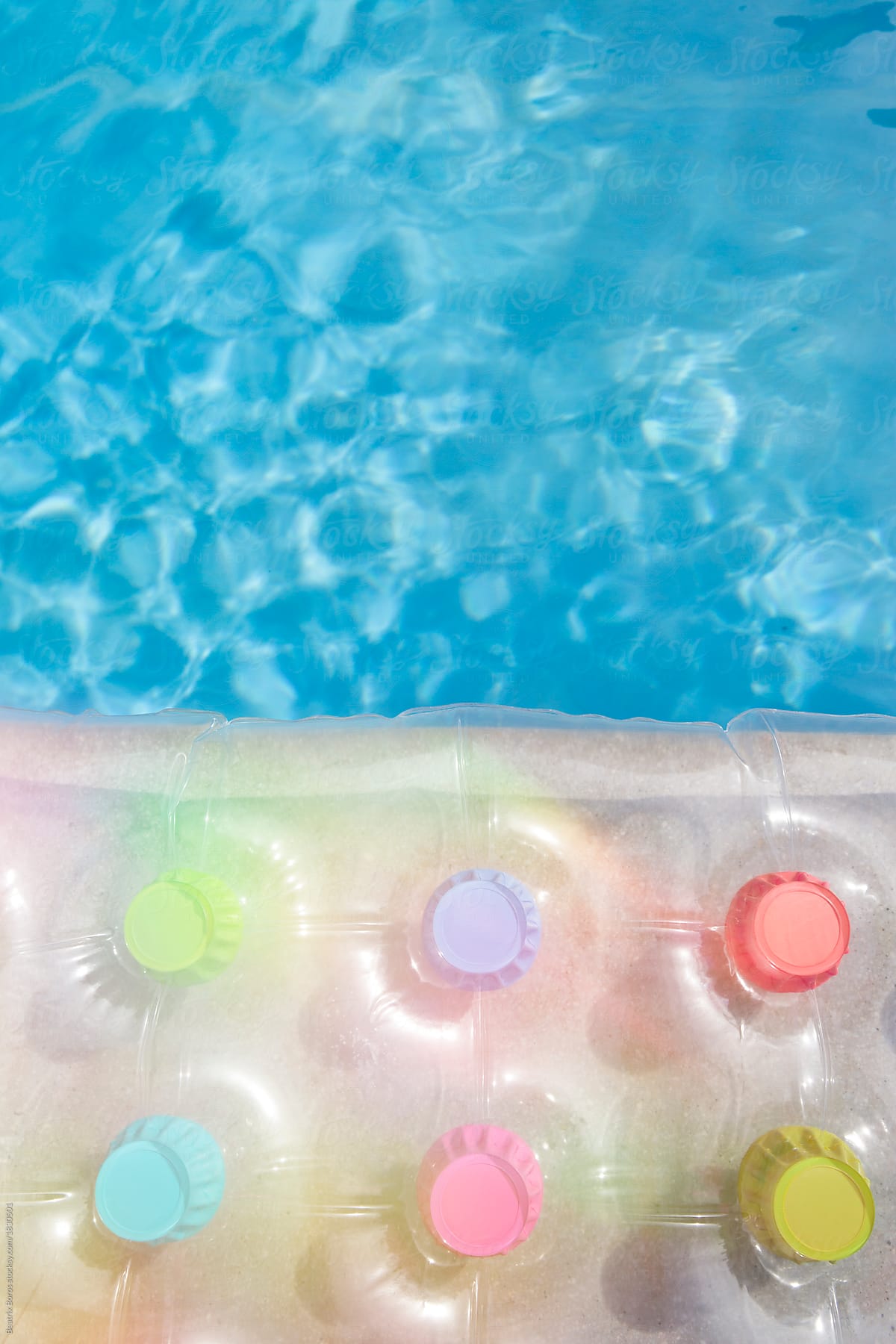 Details of a transparent air mattress on the water in Summer time