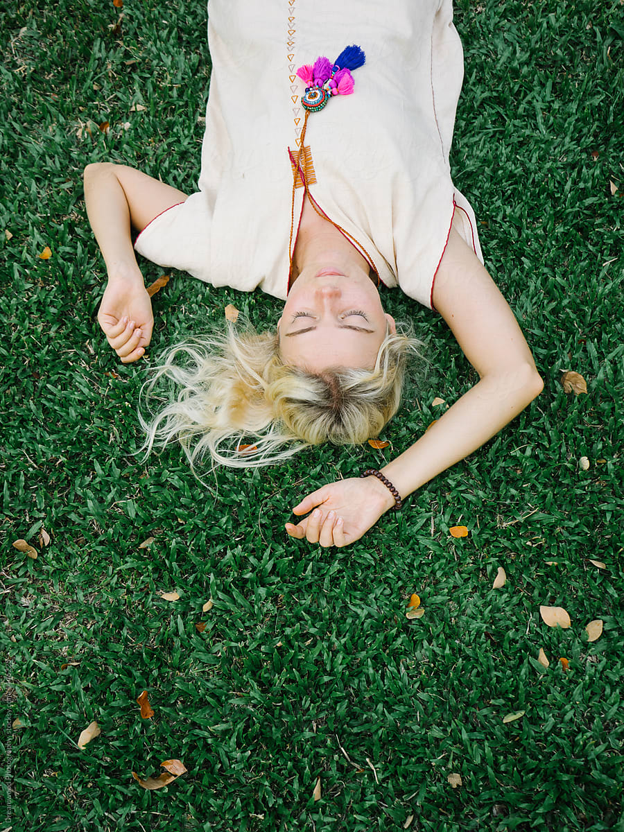 Woman Lying On Grass Del Colaborador De Stocksy Dreamwood Photography Stocksy