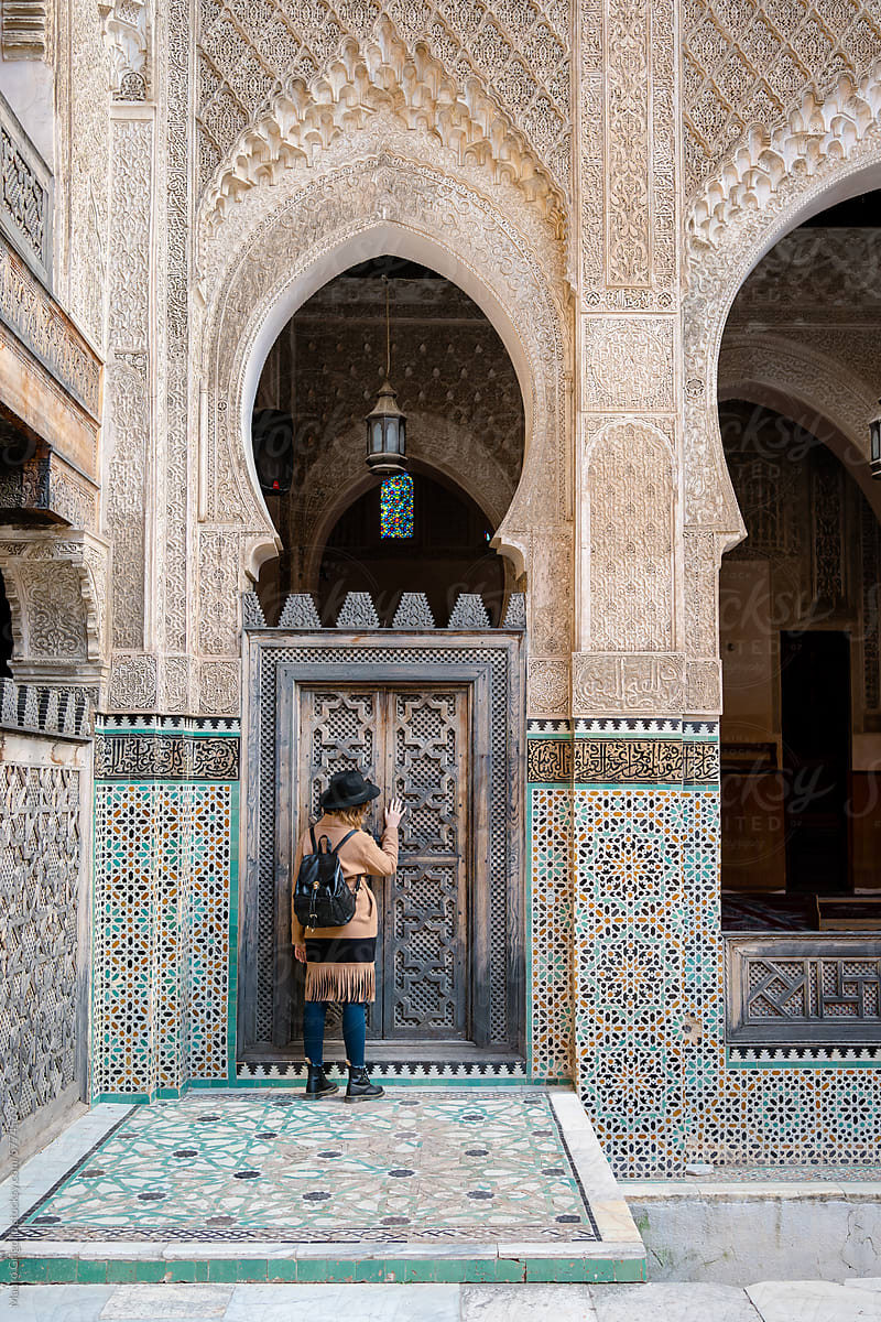 A woman visiting a Moroccan-style palace