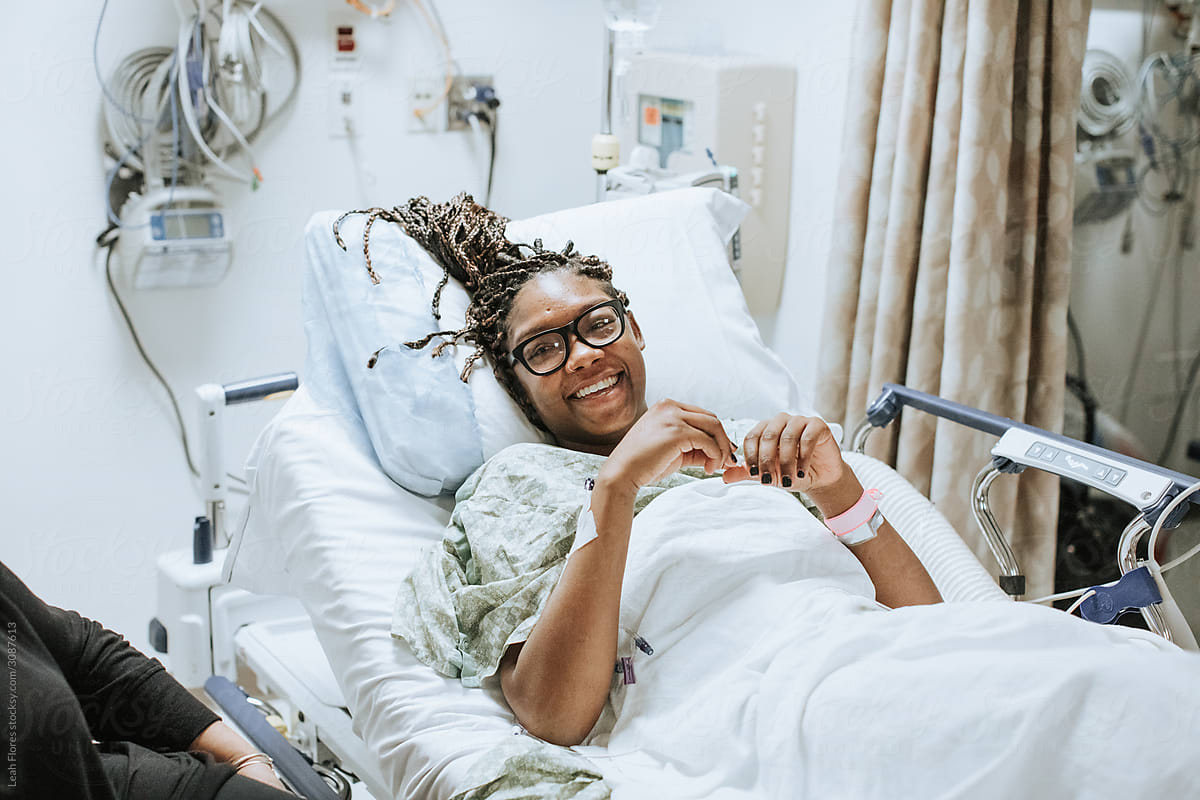Woman Smiling in Hospital Bed