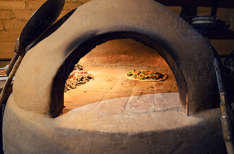 Pizza in the rustic firewood oven