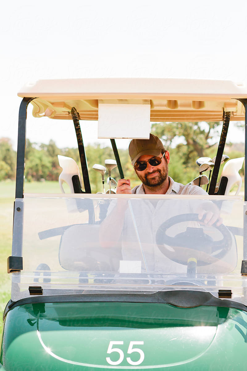 Male Golfer on a Cart