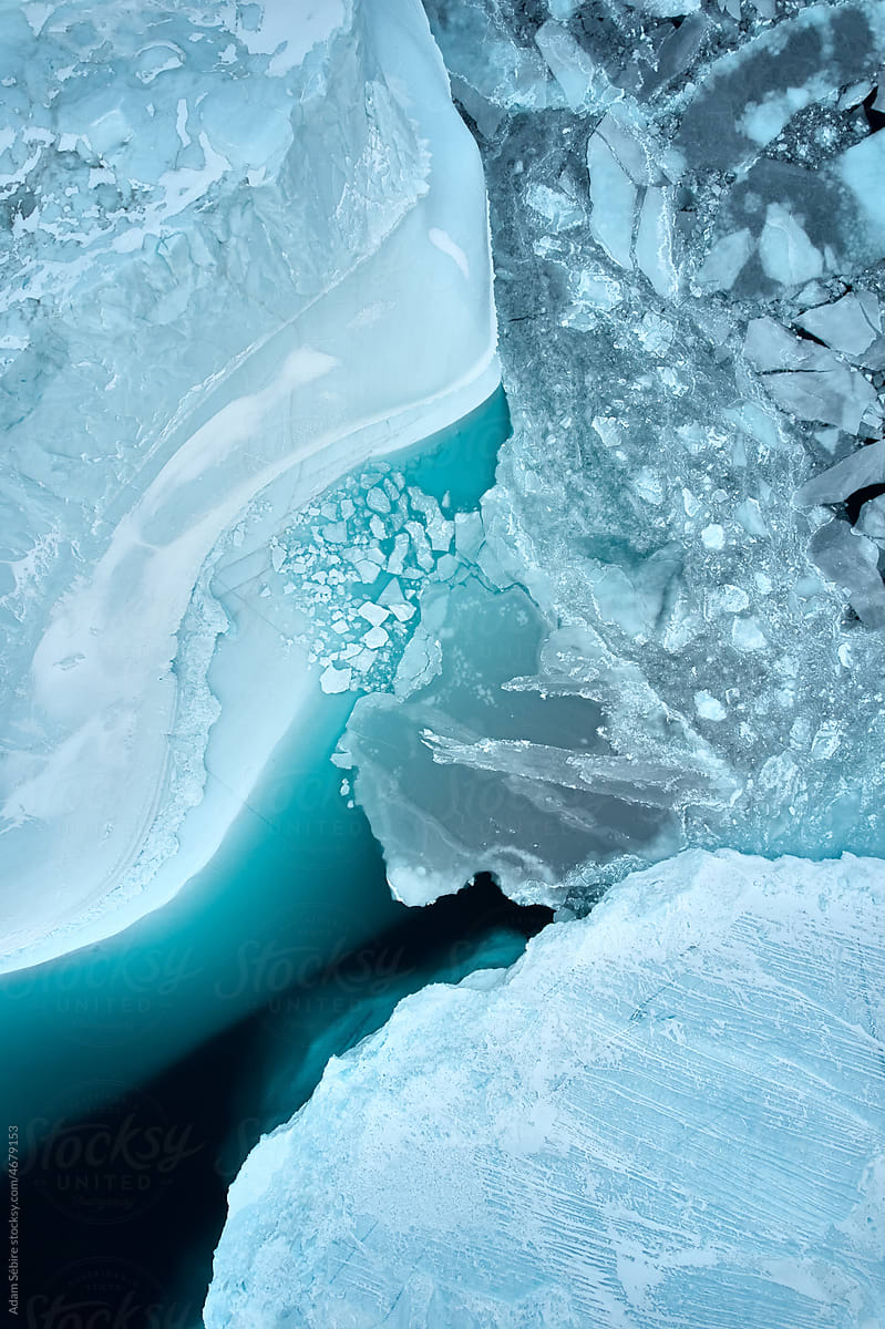 Luminous glowing blue floating Arctic ice formations