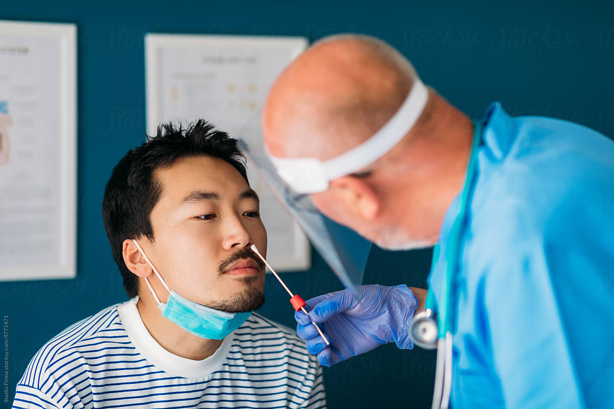 Doctor Taking Nasal Swab from Patient