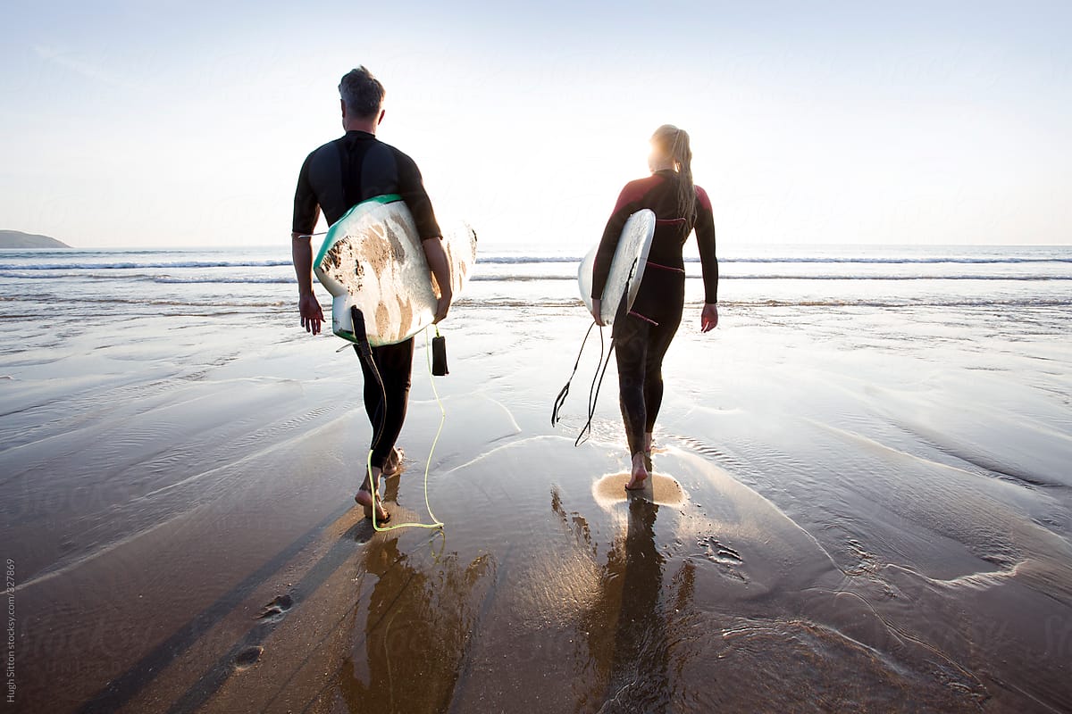 Surf Couple At Beach By Stocksy Contributor Hugh Sitton Stocksy 3420