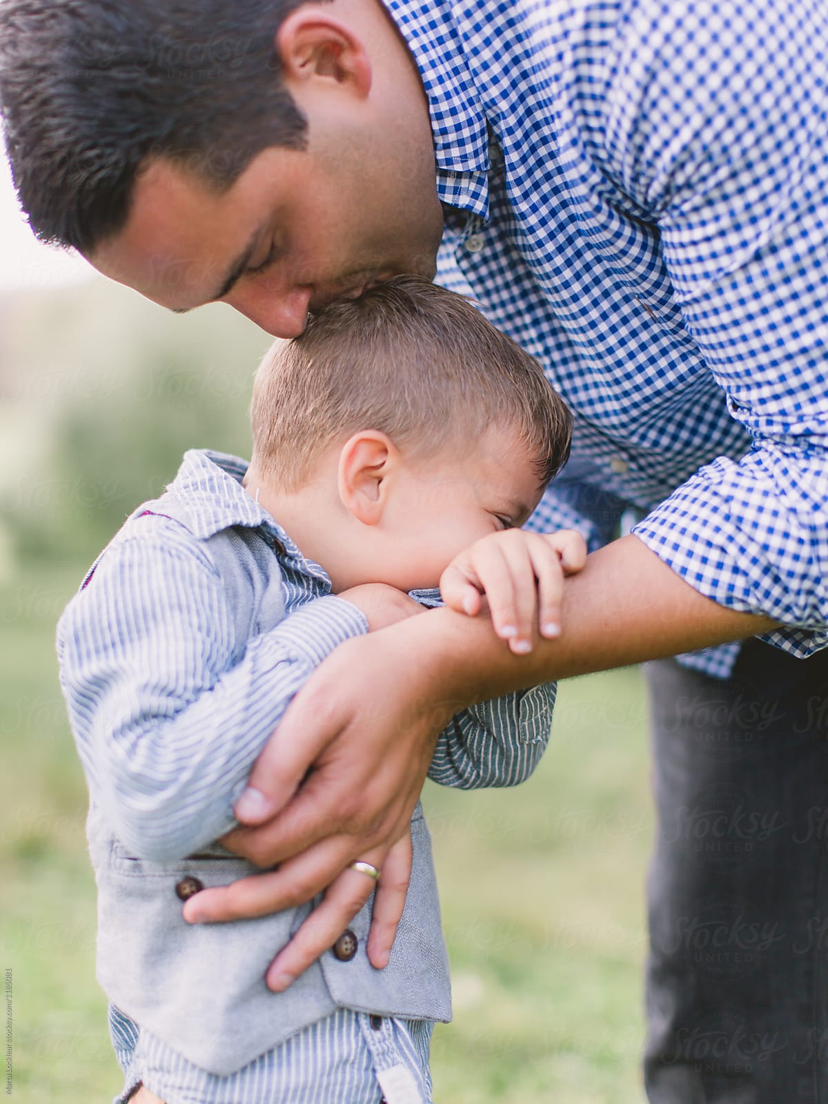 "Dad Kisses" by Stocksy Contributor "Marta Locklear" - Stocksy