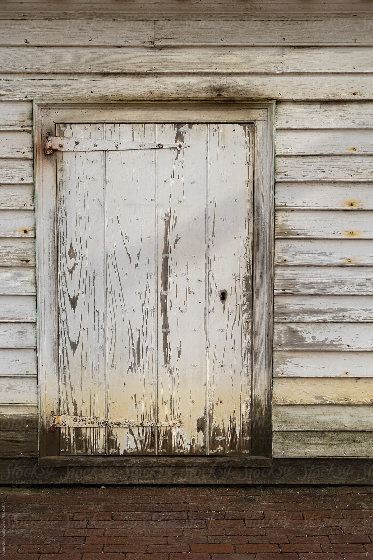 Old weathered white door