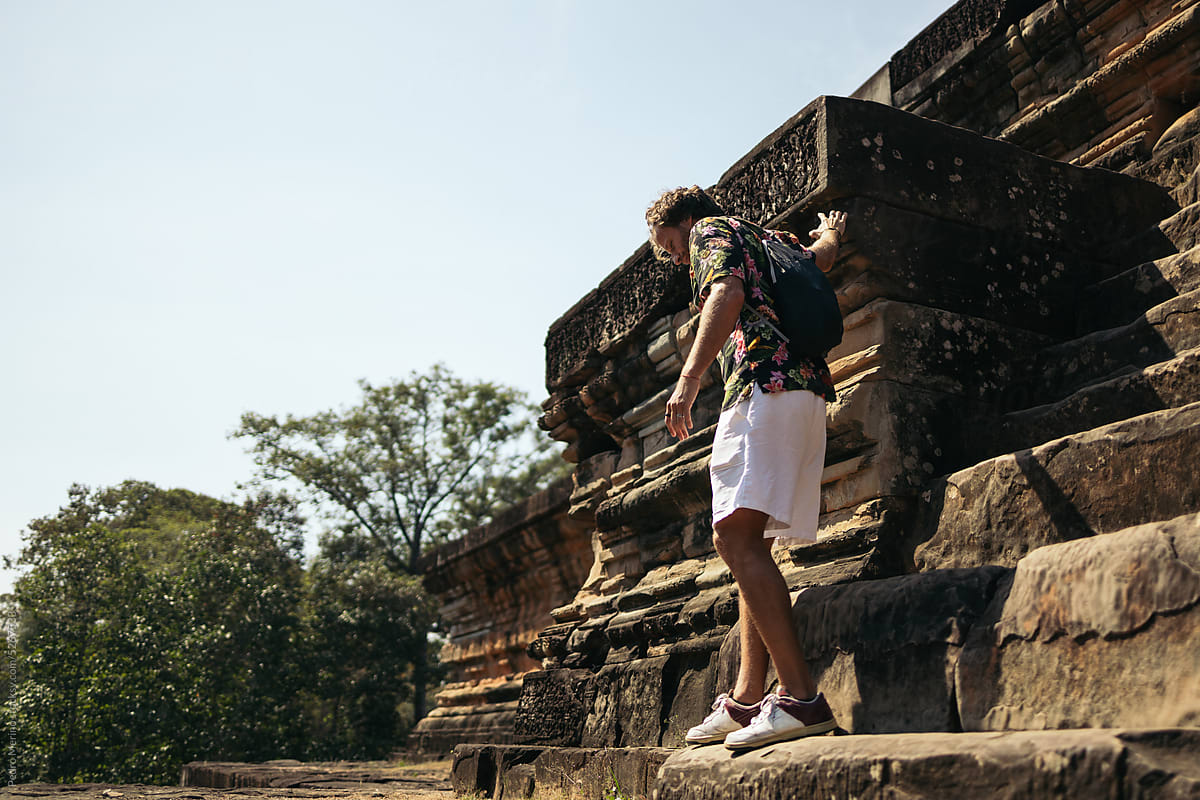 Tourist visiting ancient temples in Southeast Asia