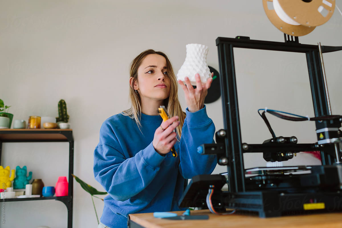 Woman looking at a 3D-printed object