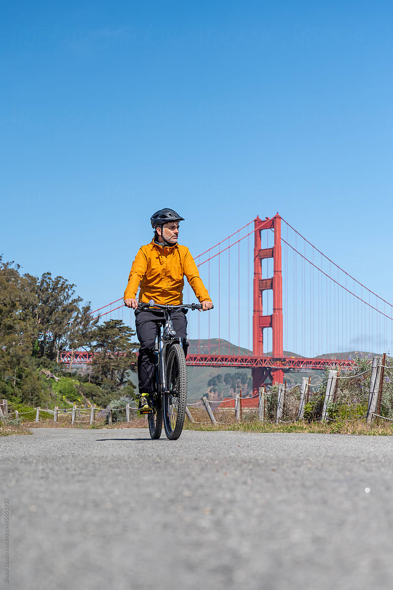 Tourist man riding a bike in San Francisco