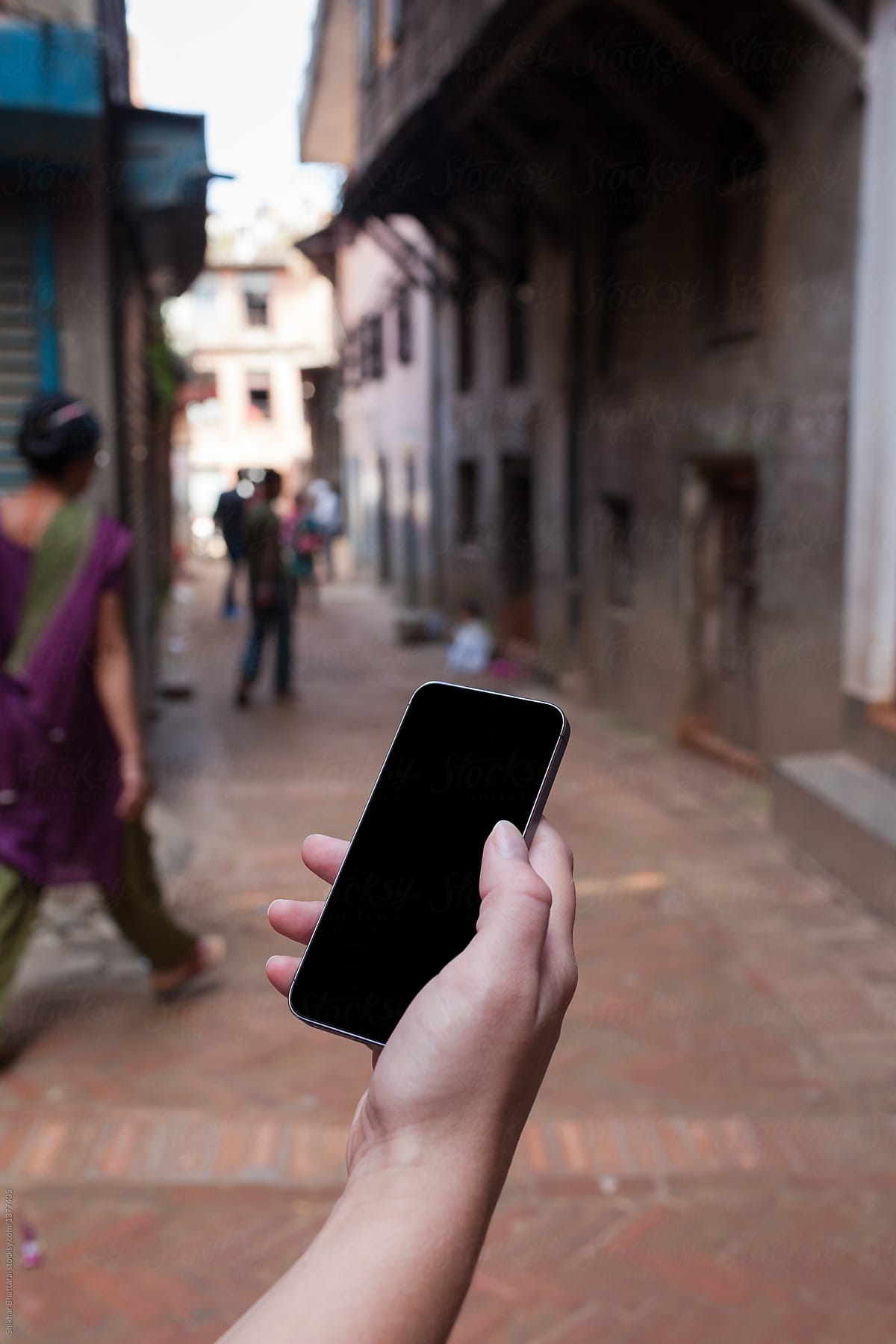 Hand Using A Mobile App To Navigate In The Streets By Stocksy