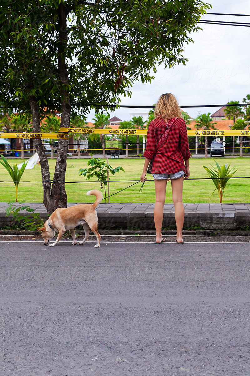 Girl with a dog on a walk during a pandemic