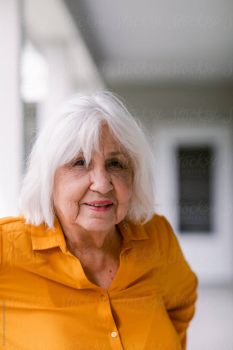Content Senior woman at elderly housing apartment portrait