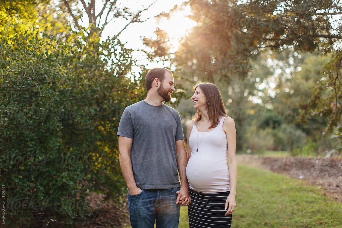 Pregnant Couple Holding Hands By Stocksy Contributor Jakob Lagerstedt Stocksy 