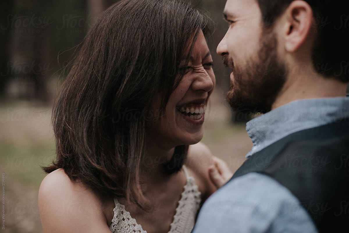 Couple Laughing Outdoors By Stocksy Contributor Jess Craven Stocksy 