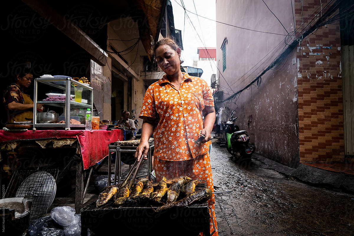 Fresh catfish being grilled on the street in Cambodia