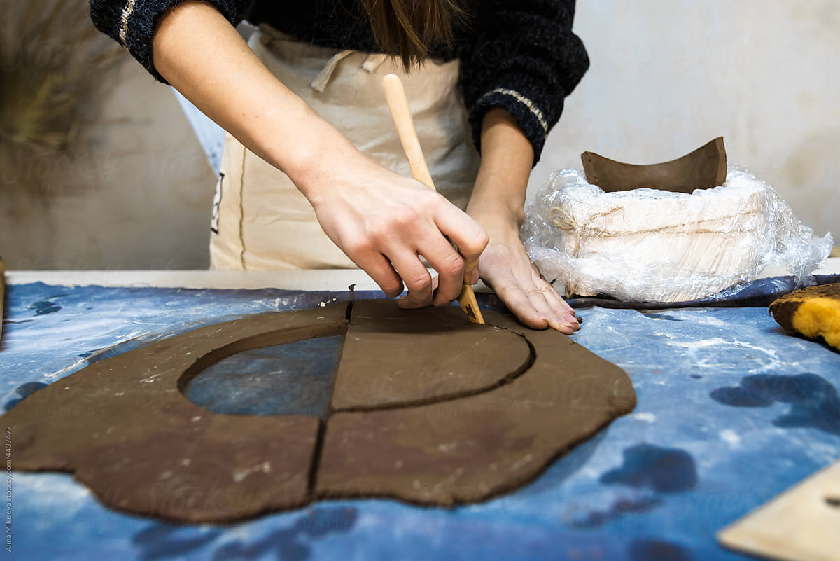 Anonymous Artisan Making Part Of Pottery In Studio