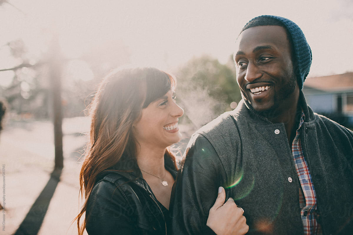 Interracial Couple Laughing On Walk By Phil Chester Photography
