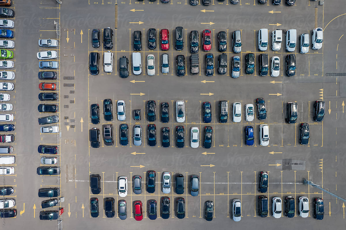 View from drone on parking lot with autos parked in marked places