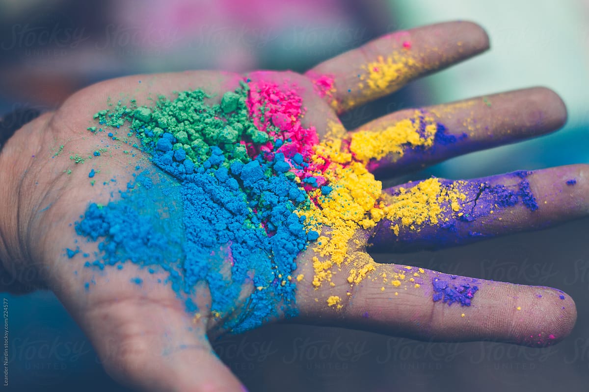 hand with different colors holi powder