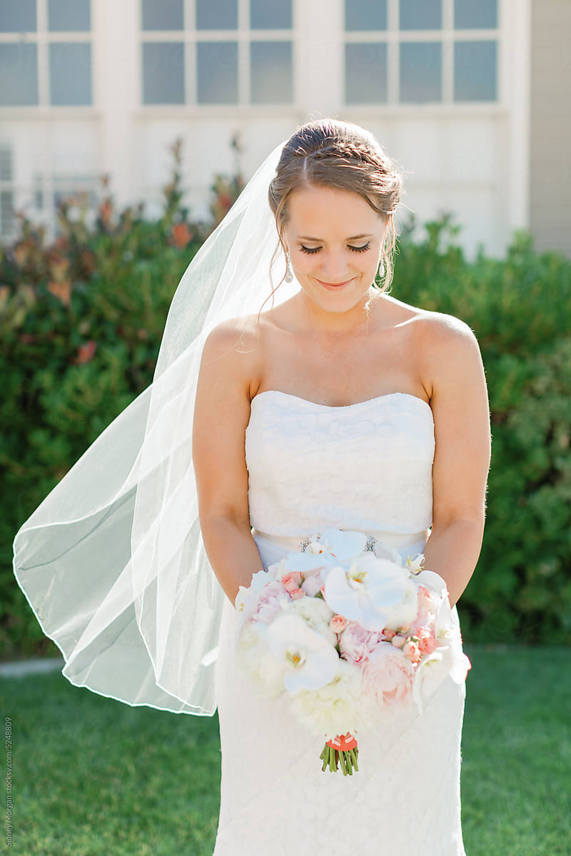 Bride Looking at Flowers