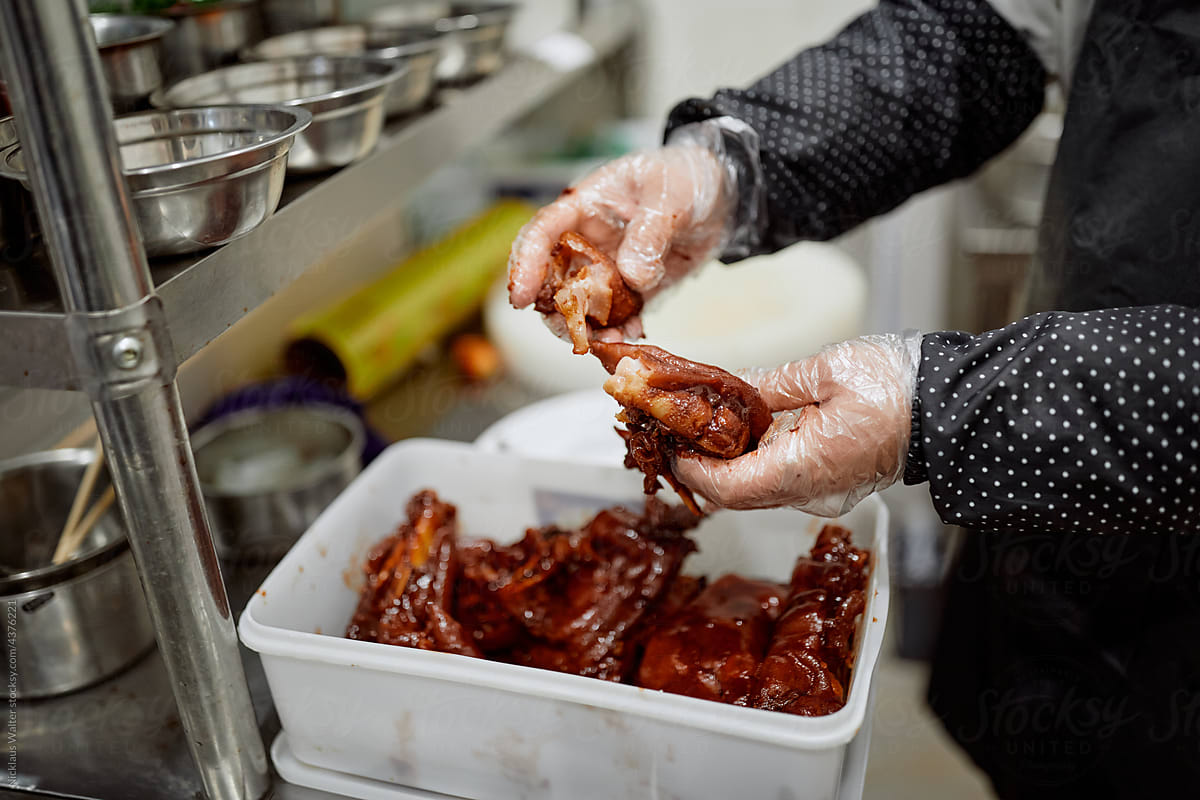 Chef Prepares Pig Feet At A Restaurant In Anhui, China