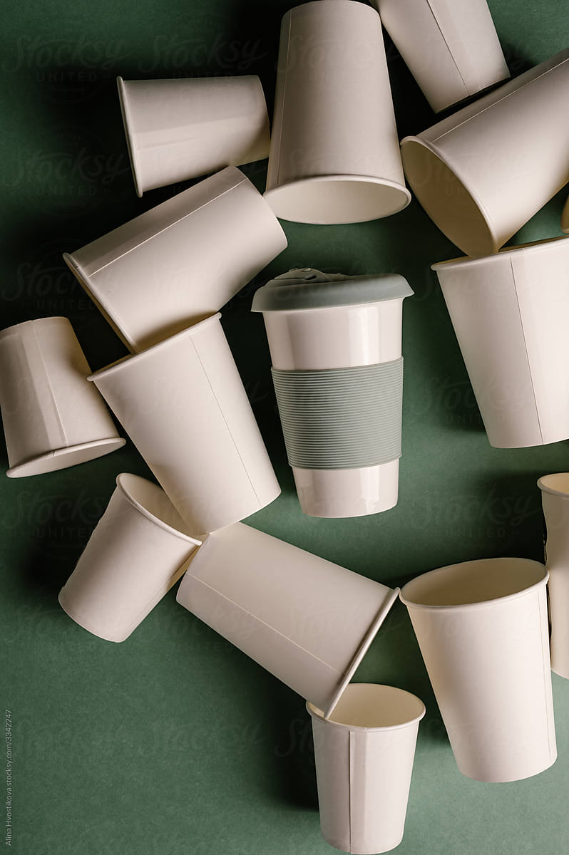 Disposable cups around reusable mug